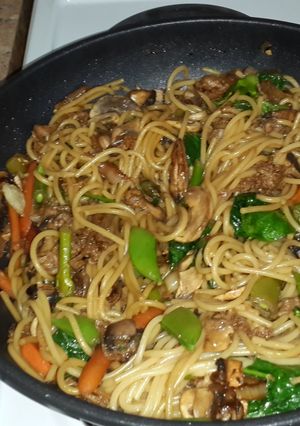 A picture of Vegetable stir fry with spaghetti.