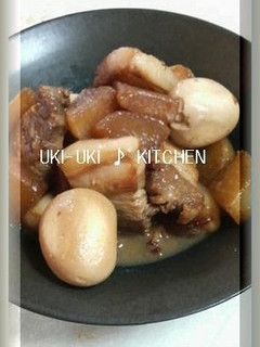 A picture of Simmered Pork Belly with Eggs and Daikon Radish.