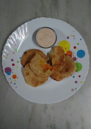A picture of Sweet Kachori with Spicy Dip.