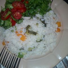 White rice,carrot,peas,cucumber, with lattuce, A picture of White rice,carrot,peas,cucumber, with lattuce,.