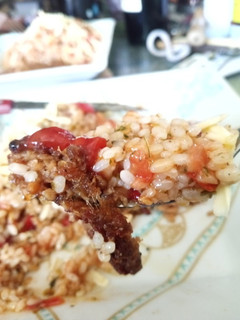 Una foto de Arroz vegano con tomate y orégano
