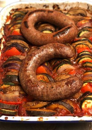 A picture of Farm shop wild boar and venison sausages on ratatouille.