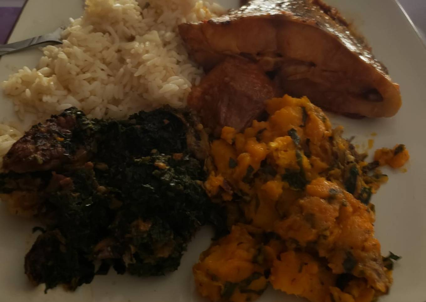 Boiled rice with vegetables and porriage yam with fish