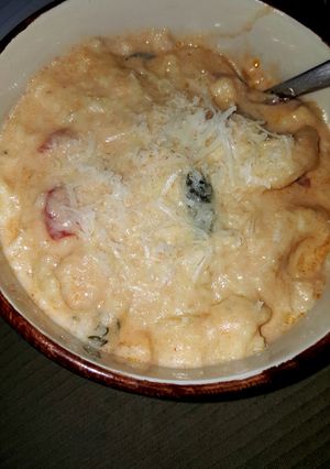 A picture of Cheese tortellini and Italian sausage soup.