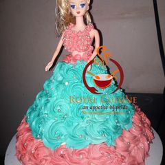 A picture of Vanilla doll cake with butter cream icing.
