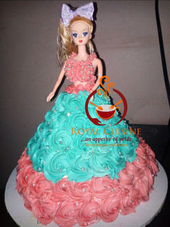 A picture of Vanilla doll cake with butter cream icing.