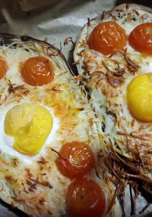 Una foto de Berenjenas rellenas con queso y huevo