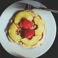 A picture of Waffles with dried fruits and cinnamon.
