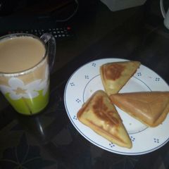 A picture of Tea and a snack.