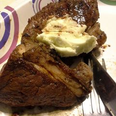 A picture of Grilled Chipotle-rubbed Steaks with Lime Butter.