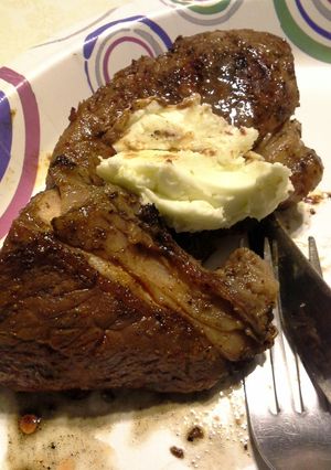 A picture of Grilled Chipotle-rubbed Steaks with Lime Butter.