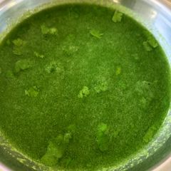A picture of Green spicy panipuri water aka tikha pani.
