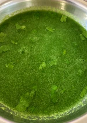 A picture of Green spicy panipuri water aka tikha pani.