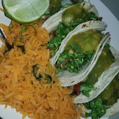 A picture of Fajita & chicken tacos, rice.