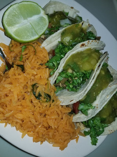 A picture of Fajita & chicken tacos, rice.