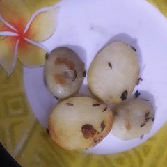 A picture of Baked potatoes on pan.