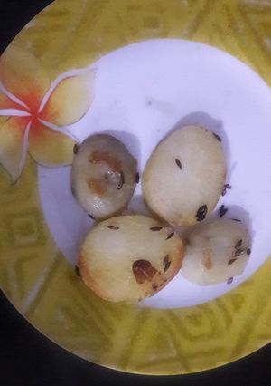 A picture of Baked potatoes on pan.
