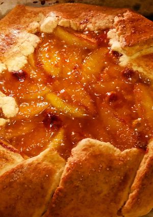 A picture of Rustic apricot-glazed pear galette.
