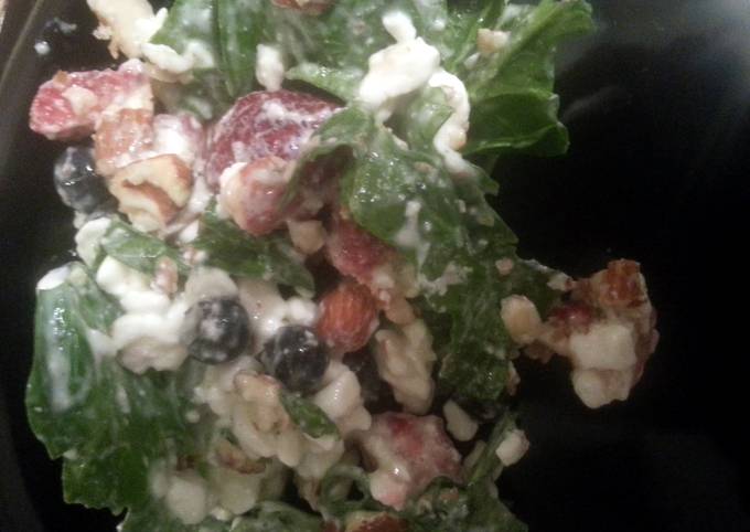 Recipe of Homemade spinich, berry, nuts, and cheese salad.