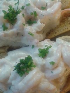 A picture of Swedish shrimp on garlic bread.