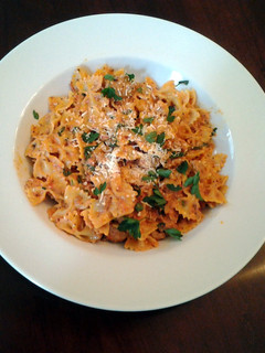 A picture of Bow Ties with sausage tomatoes and cream.