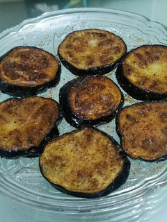 A picture of Fried Brinjal slices.