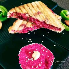 A picture of Beet Hummus Sandwich.