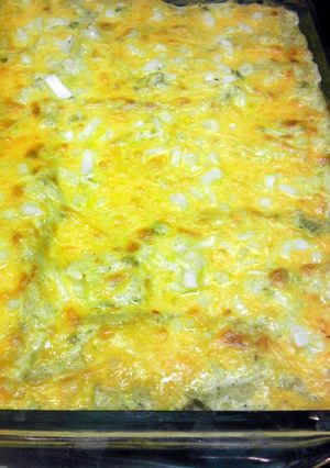 A picture of sour cream and cheese enchiladas.