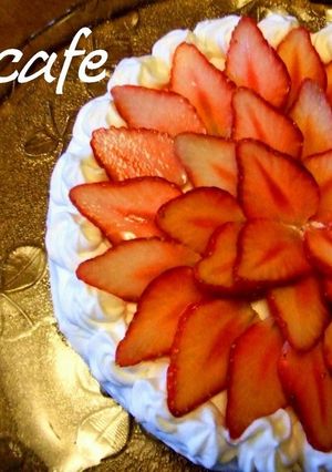 A picture of A Strawberry Cake Decorated like a Flower.
