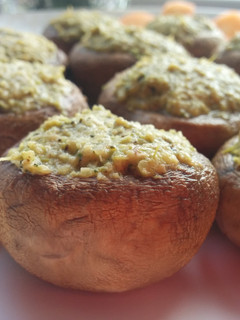 A picture of Champignons with vegetable filling.