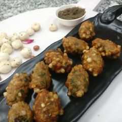 A picture of Sago & potatoes rolls Stuffed with dry fruits.