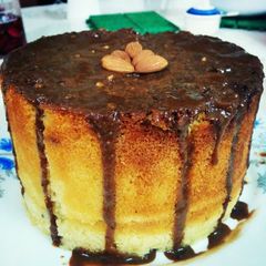 A picture of Almond spongecake with chocolate frosting.