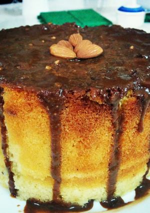 A picture of Almond spongecake with chocolate frosting.