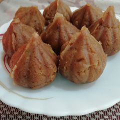 A picture of Gram Flour & pistachio Modak.