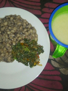 A picture of Groundnut oil vegetable beans and garri.