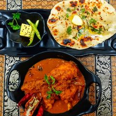 Spicy Bihari chicken curry and naan A picture of Spicy Bihari chicken curry and naan.