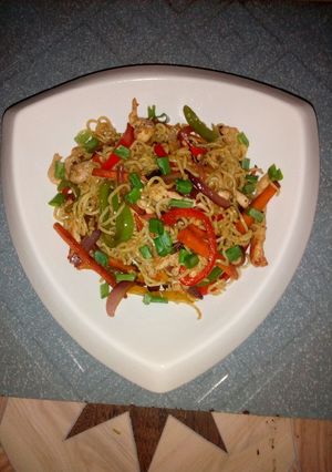 A picture of Tricolour chicken stir fried noodles.