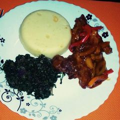A picture of Fajita pork strips served with Buttered mashed potatoes and Stir Fried Spinach.