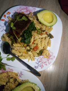 A picture of Macaroni with baked beaf and steam spinach with brocolli.