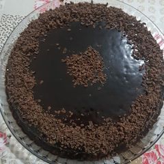 A picture of Choco cake with Chocolate ganache topped with Chocolate scrapes.