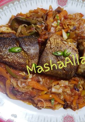 A picture of Shallow Fried seabass with stirfry veg.