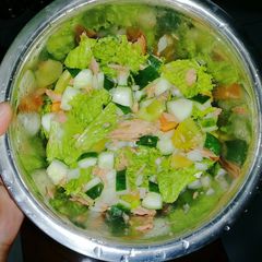 A picture of Salad in Home Made Vinaigrette Dressing.