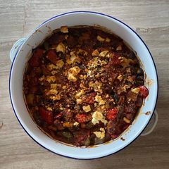 A picture of Greek peppers and sausage bake with feta.