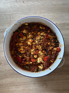 A picture of Greek peppers and sausage bake with feta.
