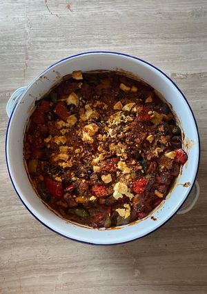 A picture of Greek peppers and sausage bake with feta.