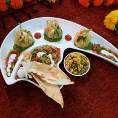 A picture of Spinach-Paneer bhurji potli with mango salsa.