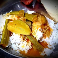 A picture of Drumstick, Brinjal and Mango Sambar.