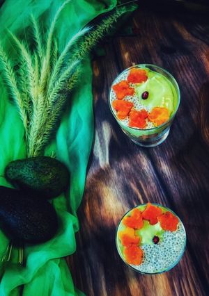 A picture of - Avocado Milkshake with chia seeds,Layered with Papayas & Vanilla Sponge Cake.
