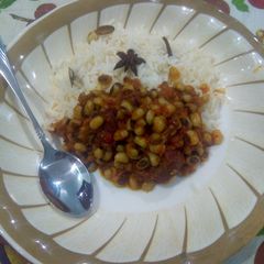 A picture of White rice with bean stew.