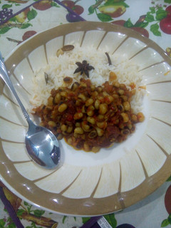 A picture of White rice with bean stew.